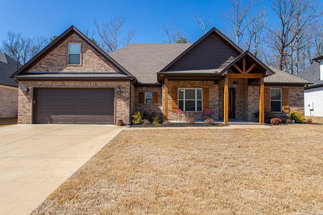 7841 S Shoreline Blvd, Benton, AR 72019 - craftsman inspired home with brick siding, driveway, a front lawn, and a shingled roof