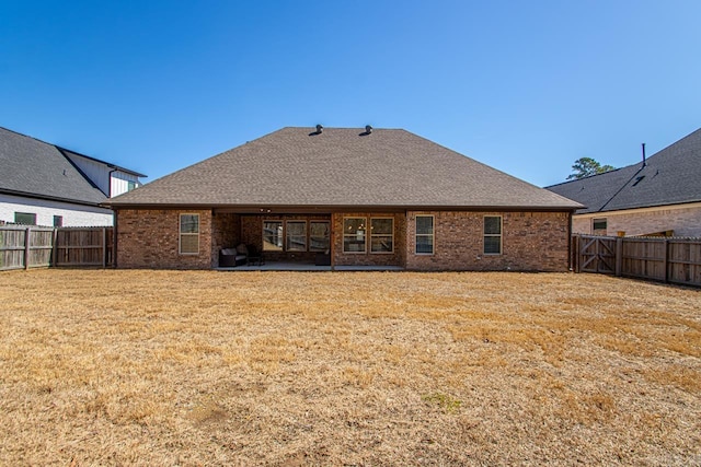 7841 S Shoreline Blvd, Benton, AR 72019 - rear view of property featuring brick siding, a patio, and roof with shingles