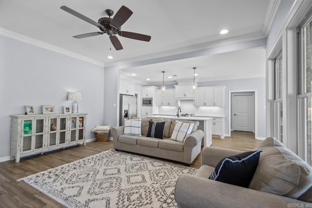 7841 S Shoreline Blvd, Benton, AR 72019 - living room featuring wood finished floors, a ceiling fan, recessed lighting, baseboards, and crown molding