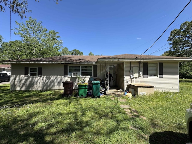 3601 Jack Mann Rd, Little Rock, AR 72210 - back of property featuring a lawn and cooling unit