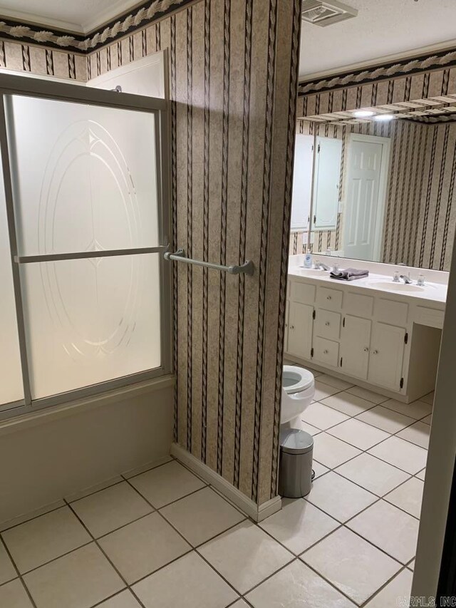 18 Riviera Dr, Conway, AR 72034 - bathroom with tile patterned floors, toilet, wallpapered walls, and vanity