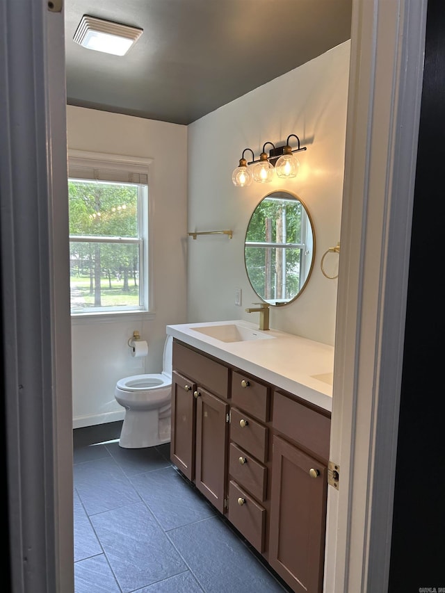 18 Riviera Dr, Conway, AR 72034 - bathroom featuring tile patterned floors, double vanity, and toilet