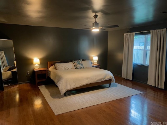 18 Riviera Dr, Conway, AR 72034 - bedroom with wood finished floors, a ceiling fan, and baseboards