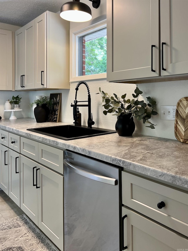 506 W Clinton St, Heber Springs, AR 72543 - kitchen featuring stainless steel dishwasher, a sink, light countertops, and tasteful backsplash