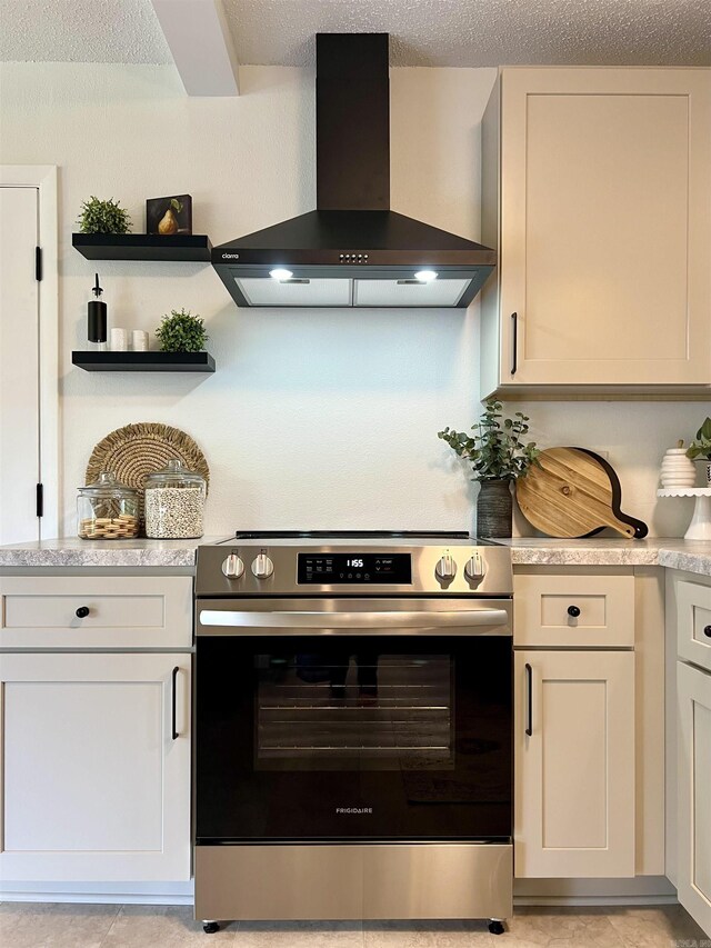 506 W Clinton St, Heber Springs, AR 72543 - kitchen featuring stainless steel range with electric cooktop, wall chimney range hood, light countertops, and open shelves