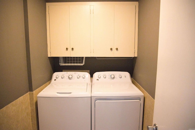 510 Frances, Magnolia, AR 71753 - laundry area featuring separate washer and dryer and cabinet space