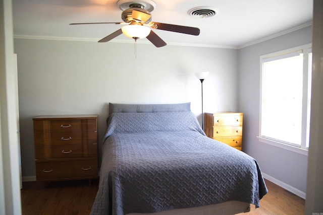 510 Frances, Magnolia, AR 71753 - bedroom with wood finished floors, ornamental molding, baseboards, and a ceiling fan
