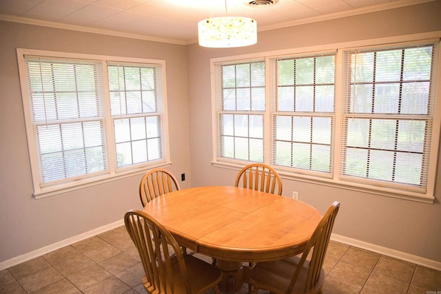 510 Frances, Magnolia, AR 71753 - dining area with baseboards, ornamental molding, and tile patterned floors