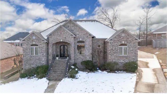 view of front facade featuring stone siding and driveway