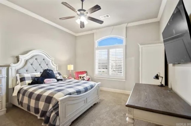 bedroom featuring light carpet, ornamental molding, baseboards, and a ceiling fan