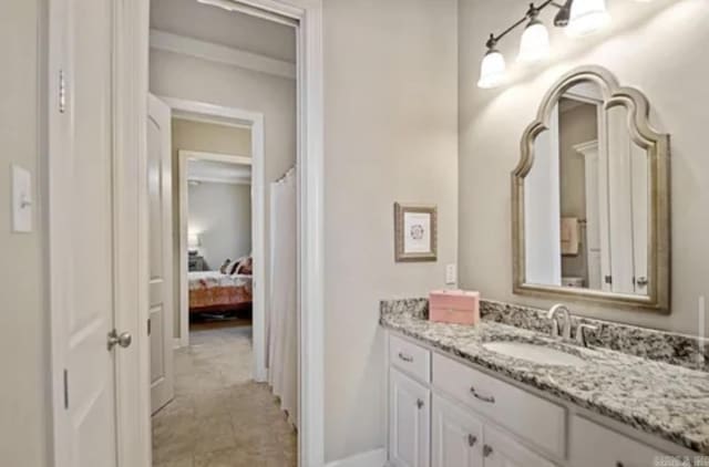 bathroom featuring vanity and baseboards
