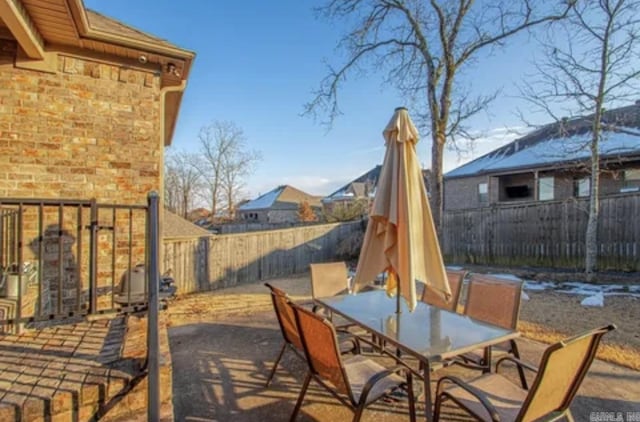 view of patio featuring a fenced backyard and outdoor dining area