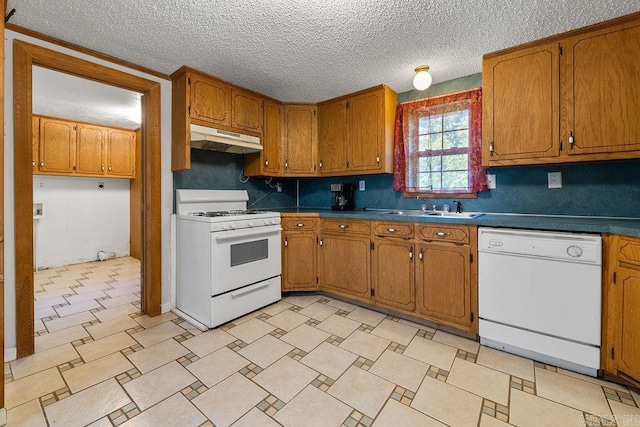 135 Cress Ln, Clinton, AR 72031 - kitchen with white appliances, under cabinet range hood, a sink, brown cabinets, and a textured ceiling