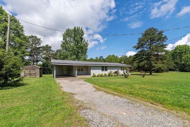 135 Cress Ln, Clinton, AR 72031 - ranch-style house featuring driveway, a shed, a front lawn, a carport, and an outdoor structure