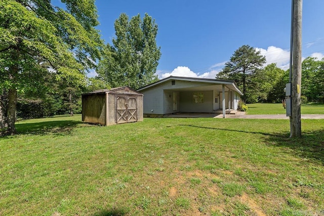 135 Cress Ln, Clinton, AR 72031 - view of shed featuring an attached carport and driveway