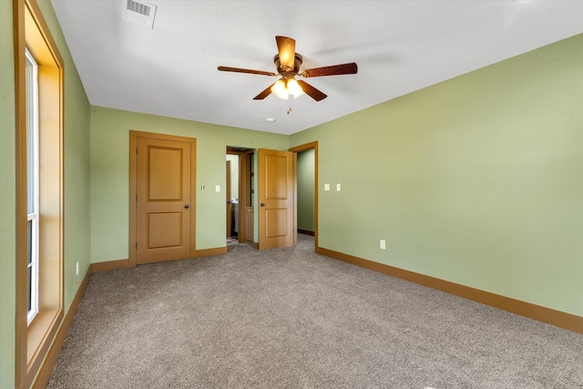 17259 Reynolds Rd, Harrisburg, AR 72432 - unfurnished bedroom featuring light carpet, baseboards, and a ceiling fan