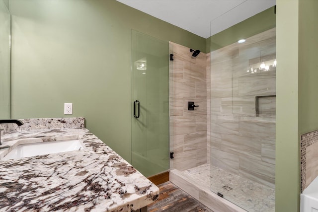 17259 Reynolds Rd, Harrisburg, AR 72432 - full bath featuring a shower stall, wood finished floors, and vanity