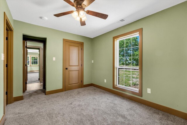 17259 Reynolds Rd, Harrisburg, AR 72432 - unfurnished room with carpet flooring, a ceiling fan, and baseboards