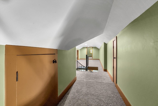 17259 Reynolds Rd, Harrisburg, AR 72432 - corridor with lofted ceiling, carpet flooring, an upstairs landing, and baseboards
