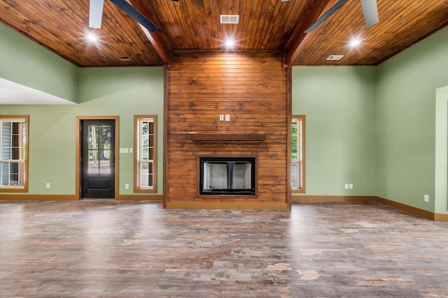 17259 Reynolds Rd, Harrisburg, AR 72432 - unfurnished living room featuring wooden ceiling, wood finished floors, a fireplace, baseboards, and a ceiling fan