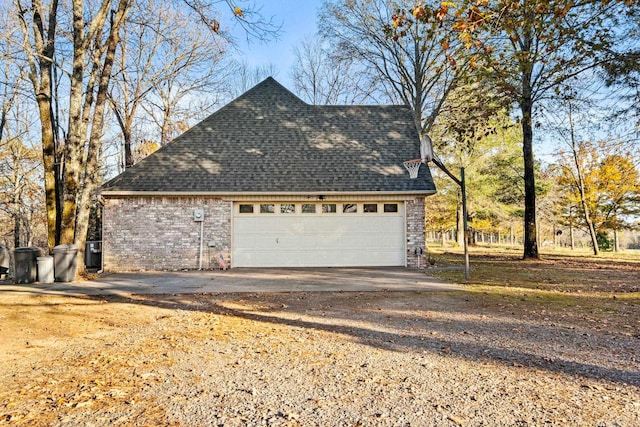 204 Pleasant Ridge Rd, El Paso, AR 72045 - view of side of property with a shingled roof and brick siding