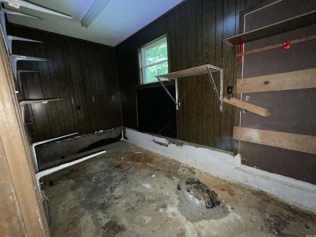 bathroom featuring wooden walls