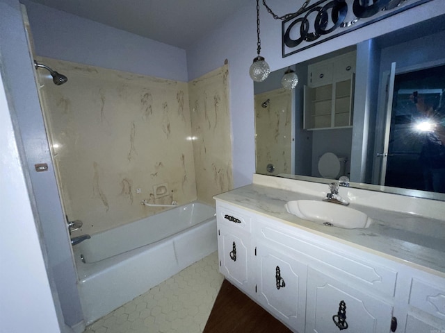 full bathroom featuring vanity,  shower combination, and wood finished floors