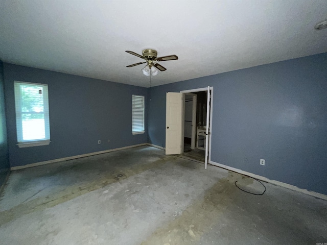 unfurnished bedroom with baseboards and a ceiling fan