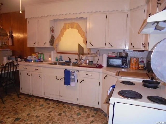 738 Pine, Amity, AR 71921 - kitchen with tile countertops, a sink, electric range, and white cabinets