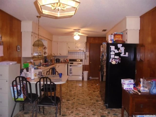 738 Pine, Amity, AR 71921 - kitchen featuring electric stove, freestanding refrigerator, ceiling fan, under cabinet range hood, and white cabinets