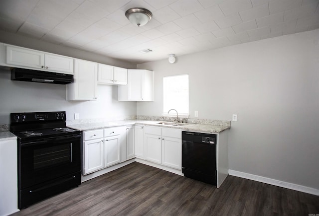 kitchen featuring black appliances, under cabinet range hood, a sink, dark wood-style flooring, and white cabinetry