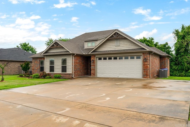 1710 Josh Dr, Conway, AR 72034 - view of front facade featuring central air condition unit, brick siding, an attached garage, and concrete driveway