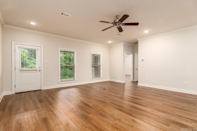 1710 Josh Dr, Conway, AR 72034 - empty room featuring ceiling fan, recessed lighting, wood finished floors, crown molding, and baseboards