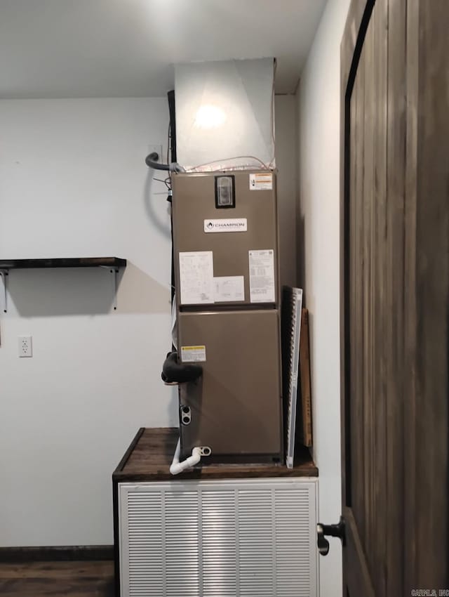 utility room with heating unit