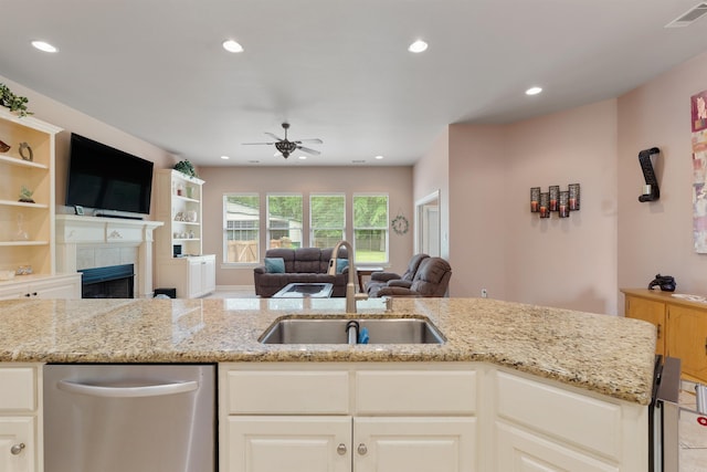 529 Enchanted Valley Ln, North Little Rock, AR 72118 - kitchen featuring a sink, ceiling fan, open floor plan, light stone countertops, and recessed lighting