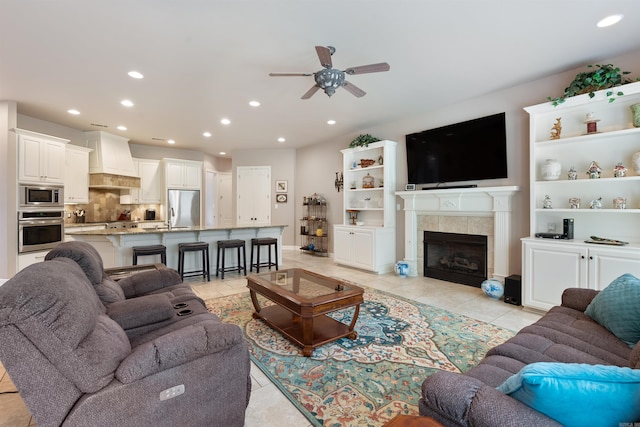 529 Enchanted Valley Ln, North Little Rock, AR 72118 - living room with a ceiling fan, light tile patterned floors, recessed lighting, a fireplace, and baseboards