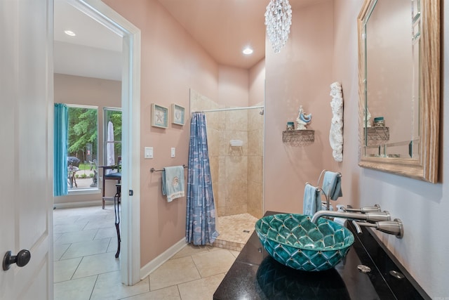 529 Enchanted Valley Ln, North Little Rock, AR 72118 - bathroom with a tile shower, tile patterned floors, baseboards, and recessed lighting