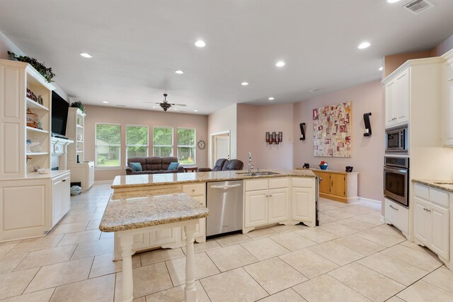 529 Enchanted Valley Ln, North Little Rock, AR 72118 - kitchen featuring stainless steel appliances, a sink, open floor plan, a ceiling fan, and recessed lighting