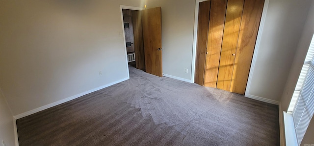 unfurnished bedroom featuring baseboards and carpet floors
