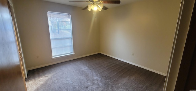 unfurnished room featuring ceiling fan, baseboards, and dark colored carpet