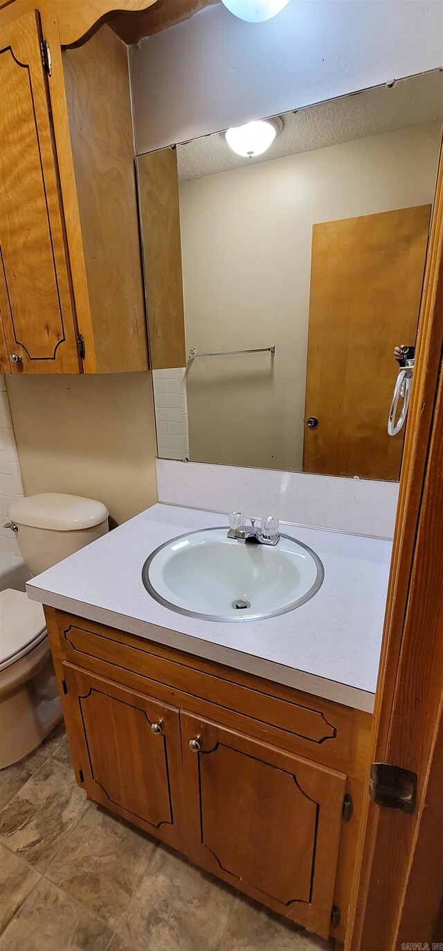 bathroom with vanity and toilet