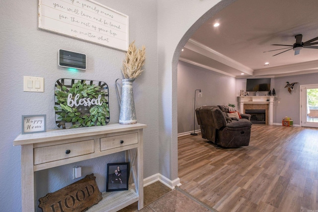 3407 Hemlock Cv, Benton, AR 72015 - hall with arched walkways, baseboards, wood finished floors, ornamental molding, and recessed lighting