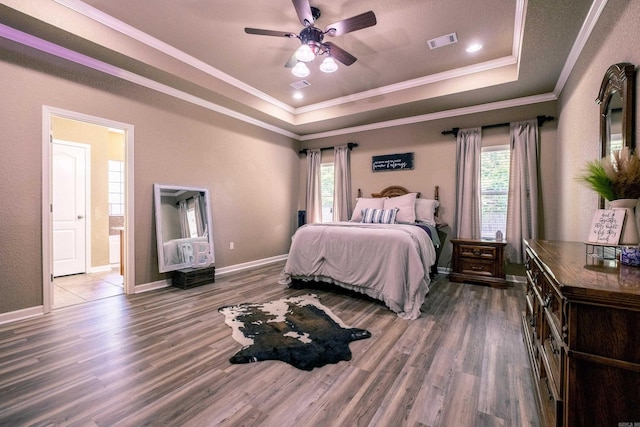 3407 Hemlock Cv, Benton, AR 72015 - bedroom featuring a raised ceiling, wood finished floors, ornamental molding, and baseboards