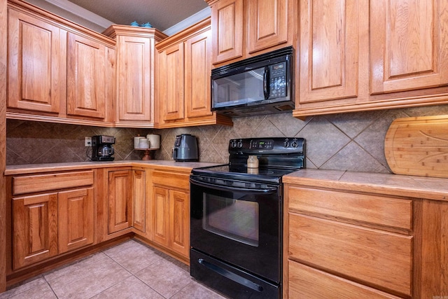 3407 Hemlock Cv, Benton, AR 72015 - kitchen featuring black appliances, tile countertops, decorative backsplash, light tile patterned floors, and crown molding