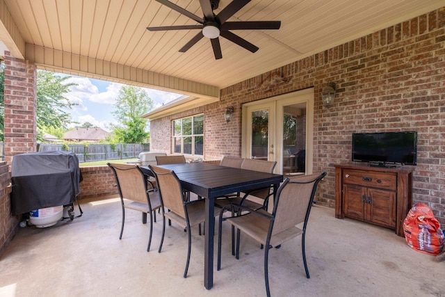 3407 Hemlock Cv, Benton, AR 72015 - view of patio / terrace featuring french doors, fence, outdoor dining space, ceiling fan, and area for grilling