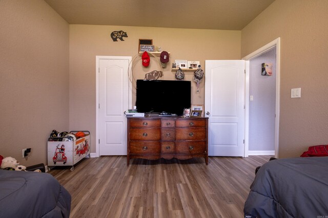3407 Hemlock Cv, Benton, AR 72015 - bedroom with wood finished floors and baseboards