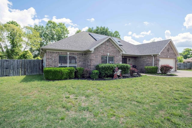3407 Hemlock Cv, Benton, AR 72015 - ranch-style home with an attached garage, brick siding, solar panels, and a shingled roof