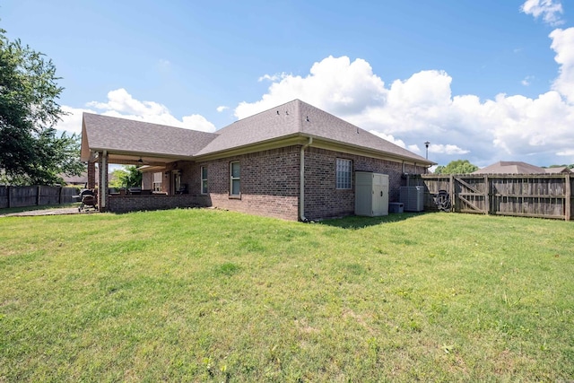 3407 Hemlock Cv, Benton, AR 72015 - back of house with a ceiling fan, brick siding, central air condition unit, and a shingled roof