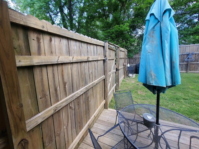 690 Redwood Dr, Piggott, AR 72454 - wooden deck with outdoor dining space