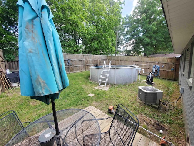 690 Redwood Dr, Piggott, AR 72454 - view of yard with central AC unit and outdoor dining space